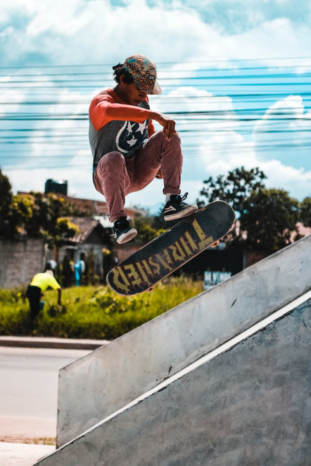 Photo of Man Playing Skateboard