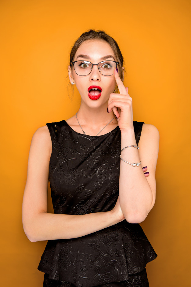 Portrait of young woman with shocked facial expression Free Photo