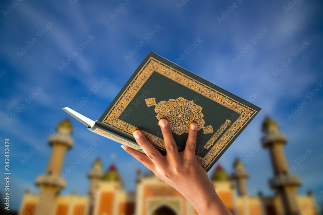 
Quran - holy book of Muslims religion, Concept: open book holy prayers for god,
 Friday In the month of Ramadan  religion Islamic worshiping faith and learn koran and rosary put on wooden  boards 