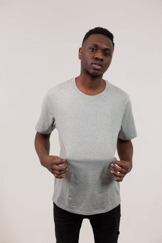 Self assured black guy demonstrating t shirt