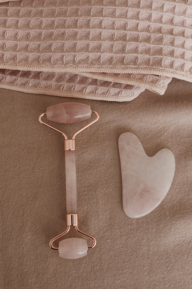 Set of quartz face massagers with waffle tower on pink plaid
