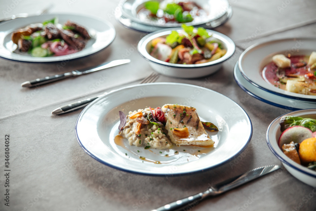 Table served with restaurant dishes chicken rice