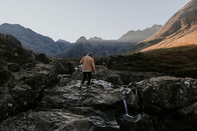 Travel background, man in rugged | Free Photo - rawpixel