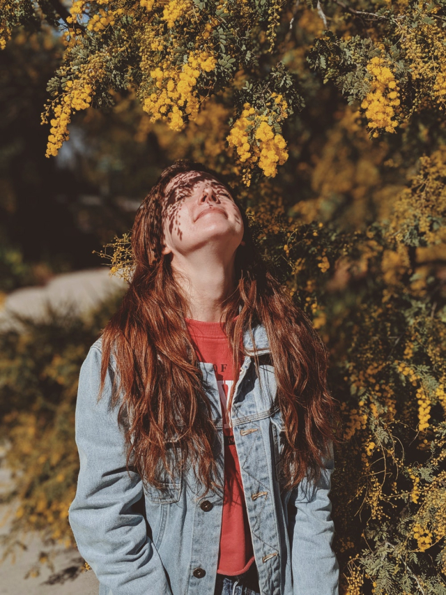 Woman Standing Under Yellow Leaf Tree