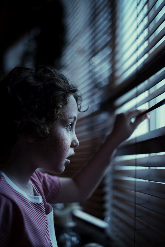 Young boy looking through the window | Free Photo - rawpixel